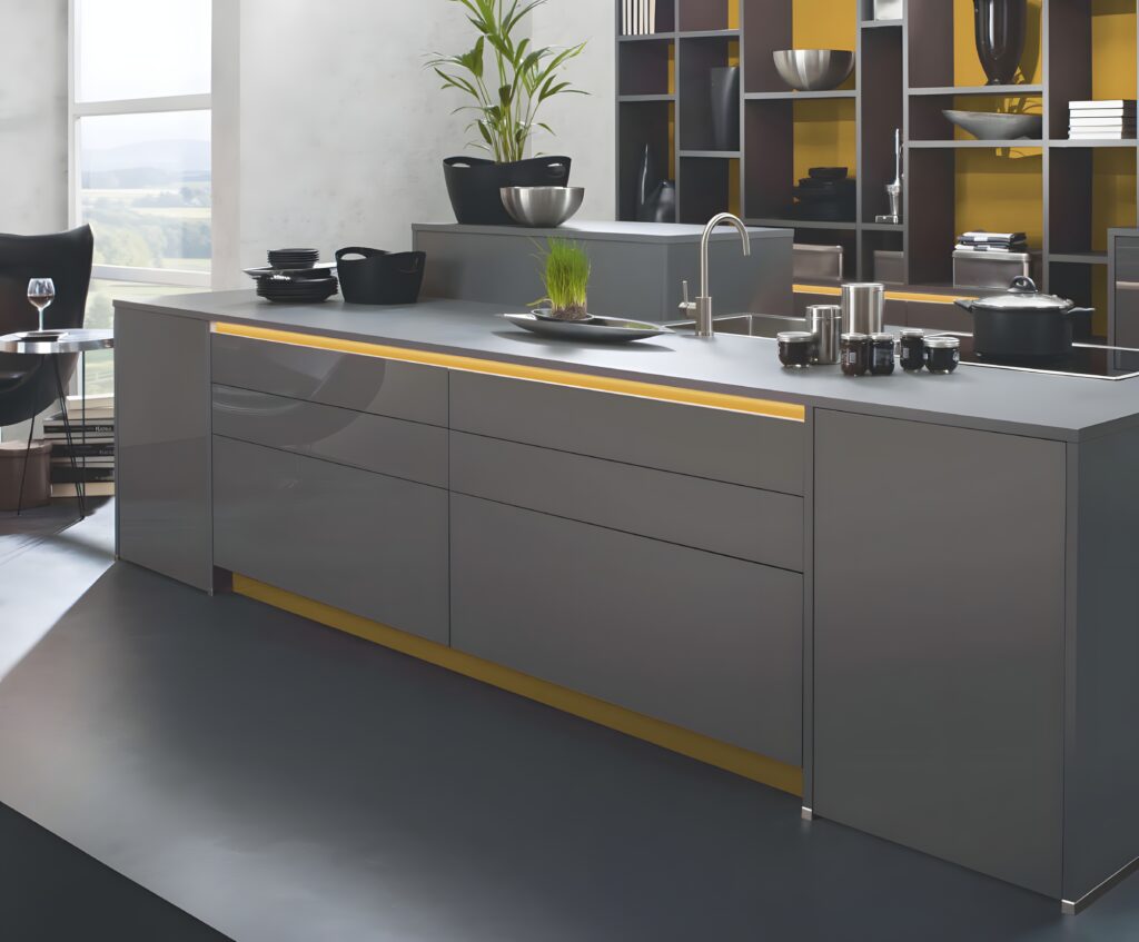 A modern kitchen with sleek, glossy cabinets, a long island countertop, and various kitchen utensils and plants on the counter. Shelves in the background hold dishes and decor items. For optimal longevity, regularly caring for high gloss kitchen cabinets is essential to maintain their pristine look.