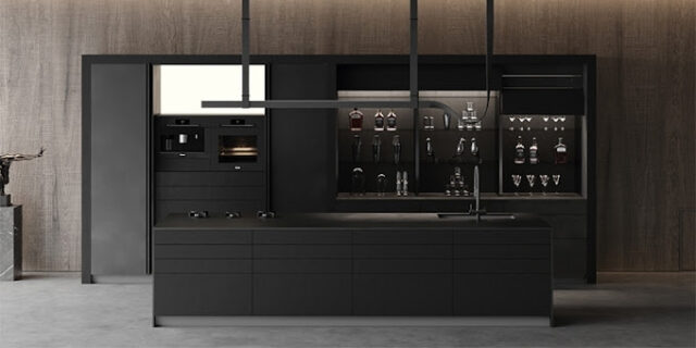 Modern kitchen featuring a sleek black island with integrated sink, built-in oven, espresso machine, and open shelving displaying glassware and bottles, capturing the latest trends in kitchen cabinet design styles.