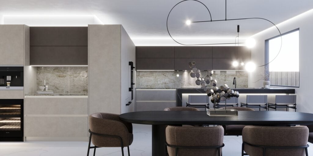 Modern kitchen and dining area with minimalist design, featuring a dark table with beige chairs, integrated appliances, and contemporary lighting fixtures. Marble backsplash and large window.