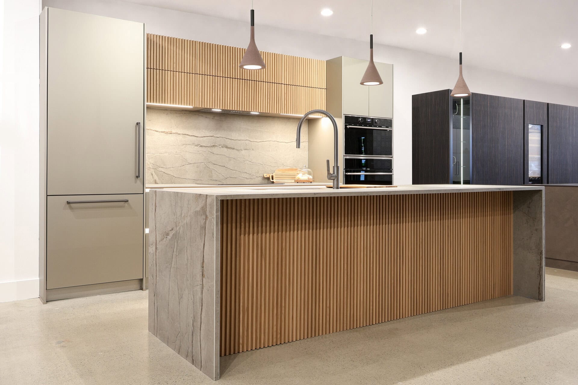 Bauformat kitchen display — fluted natural white oak island