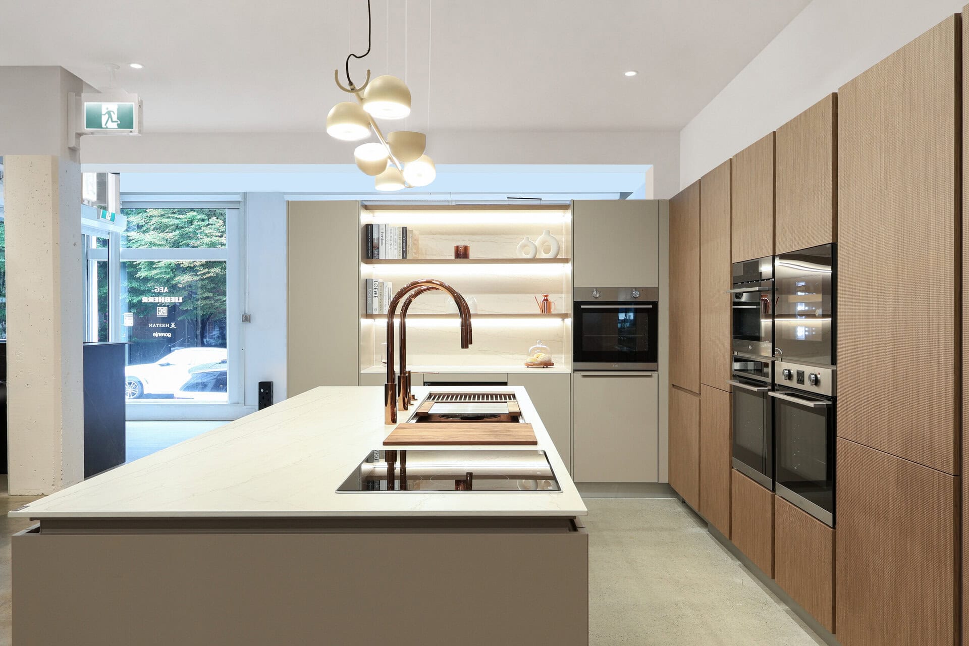 Bauformat kitchen display — handleless white oak, integrated